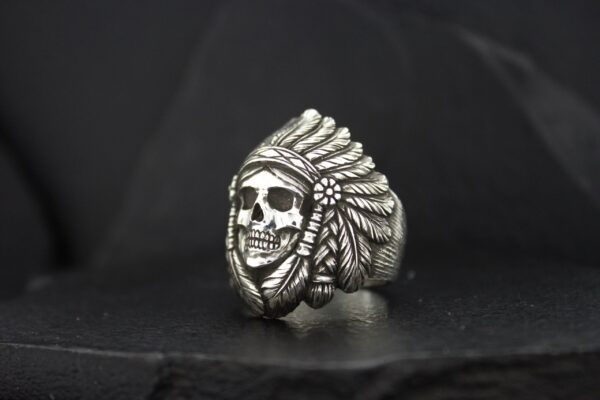 Silver ring featuring a skull with a Native American headdress.