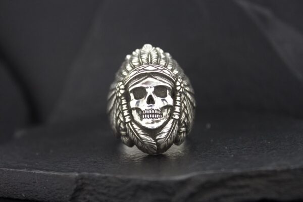 Silver skull ring with a Native American headdress design.