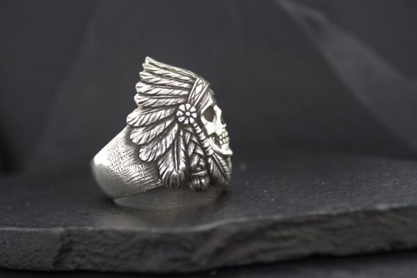 Silver ring with a detailed Native American chief head design.