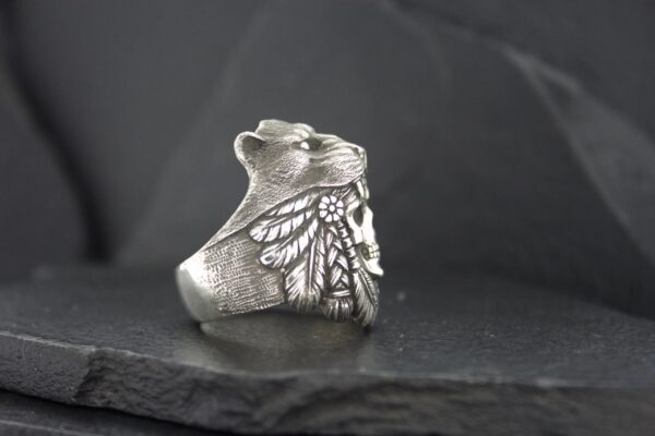Silver ring with detailed butterfly wing design.