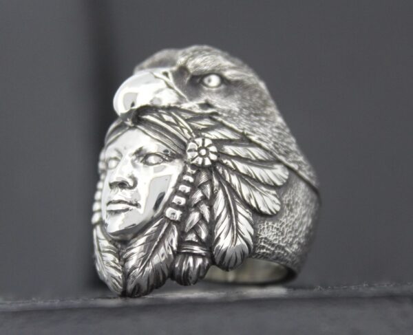 Silver ring featuring a Native American chief and an eagle.