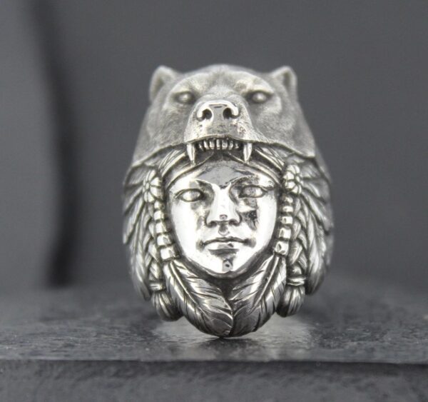 Silver ring featuring a detailed face with a bear headdress.