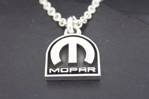 Silver Mopar logo pendant on a chain.
