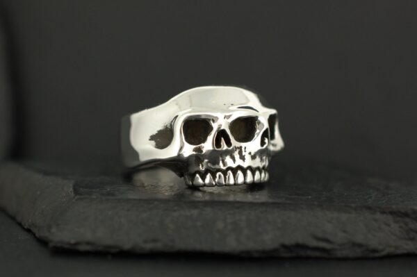 Silver ring designed as a double-layered skull.