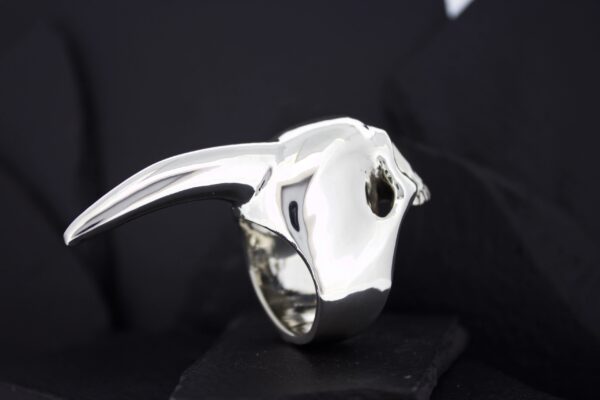 Silver ring shaped like a bull's head with horns.