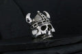 Metal skull wearing a Viking helmet with horns.