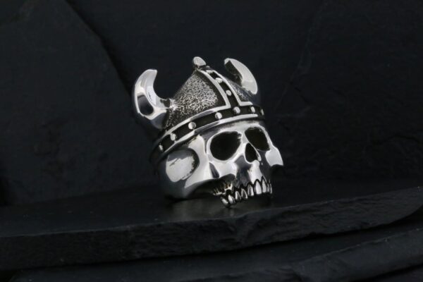 Metal skull wearing a Viking helmet with horns.
