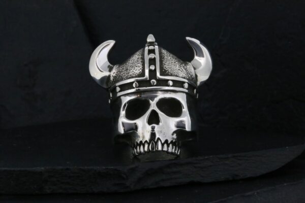 Metal skull wearing a Viking helmet with horns.