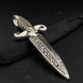 Ornate dagger with intricate carvings on the blade and handle.