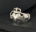 Silver Claddagh ring featuring hands, heart, and crown design.