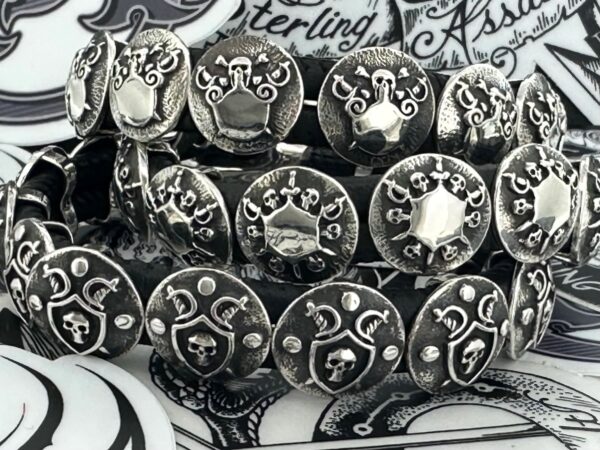 Close-up of silver rings with various intricate designs.