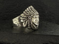 Silver ring engraved with a Native American chief wearing a feathered headdress.