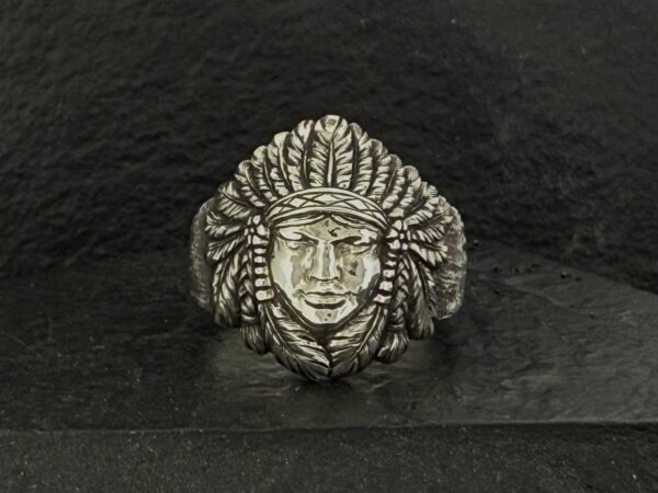 Silver ring with a Native American chief design.