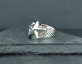 Silver ring featuring an eagle design with spread wings.