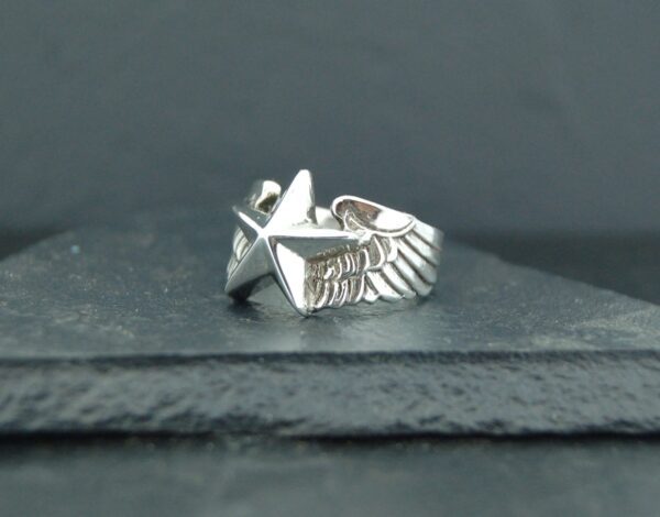Silver ring featuring an eagle design with spread wings.