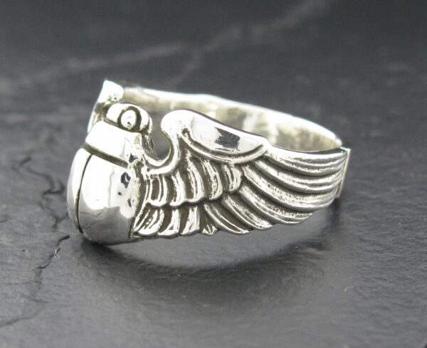 Silver ring featuring a detailed wing design.