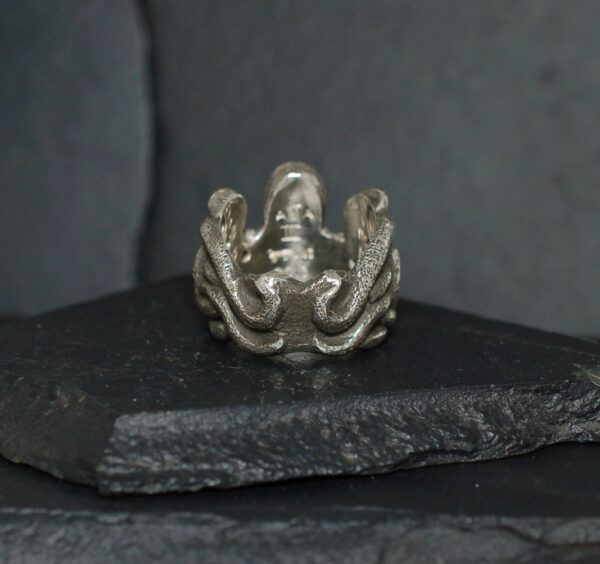 Intricately designed silver ring featuring an octopus motif.
