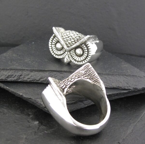 Unique owl-themed silver ring with intricate detailing.