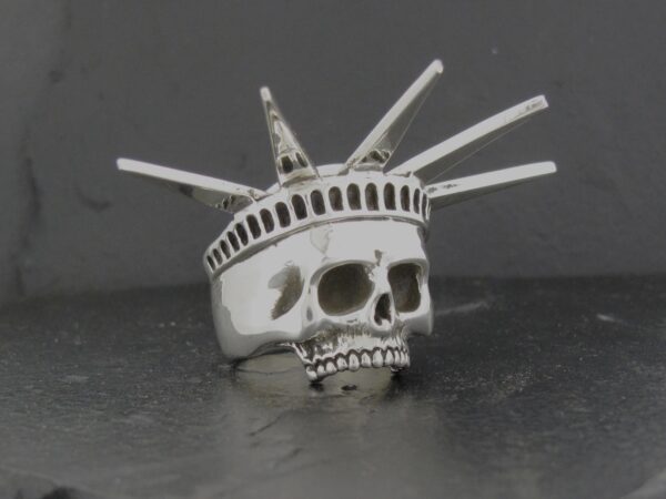 A skull ring designed like the Statue of Liberty's crown.