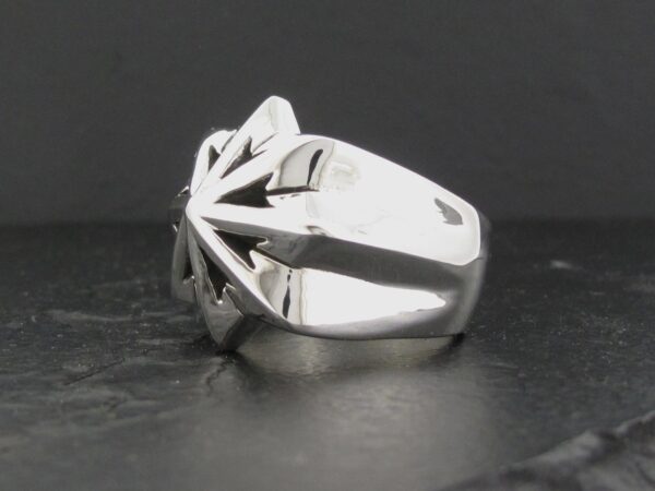 A sleek silver ring with a bold geometric design.