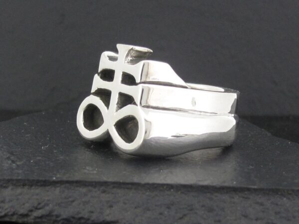 Silver ring with an abstract geometric design.