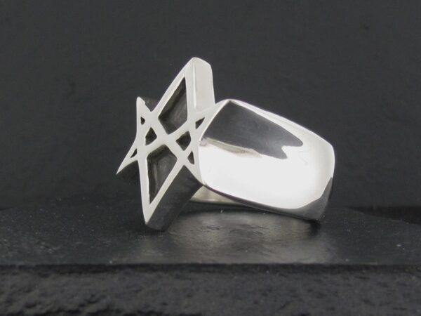 Modern silver ring with an abstract geometric design.