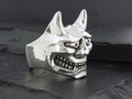 A silver metallic ring shaped like a menacing Oni mask.