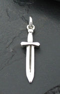 A silver sword pendant on a dark background.