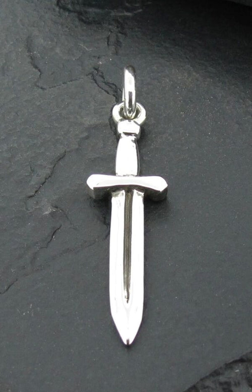 A silver sword pendant on a dark background.