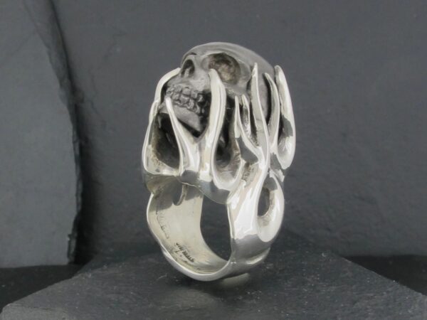Silver ring with an abstract open design.