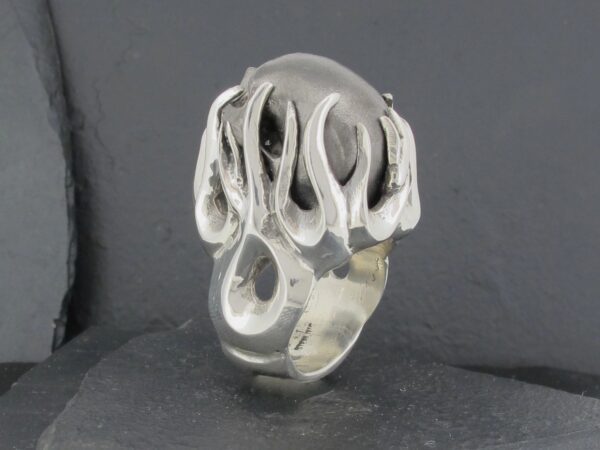 Unique silver ring with abstract, flowing design.