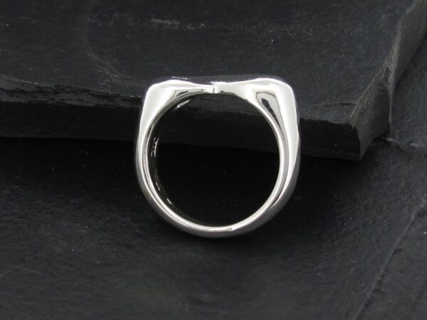 Sleek silver ring with a modern, minimalist design.