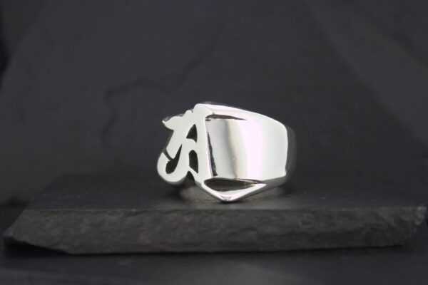 A shiny silver ring with a smooth, modern design.