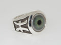 Silver ring with a realistic green eye design and black accents.