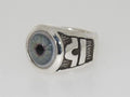 Silver ring with a detailed blue eye design on top.
