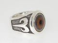 Silver ring with an eye design and ornate side patterns.