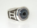 A silver ring with a detailed blue eye design on the top.