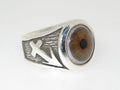 A silver ring featuring a realistic eye design and an arrow symbol.