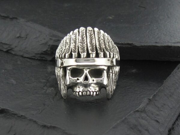 A silver skull ring with a helmet design.