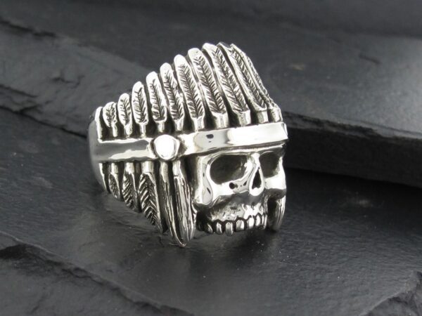 Silver skull ring with a Native American headdress design.