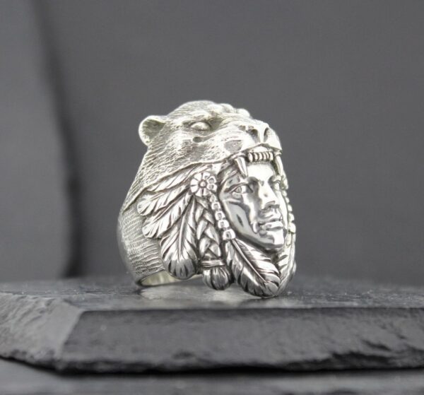 Silver ring featuring a detailed Native American chief design.