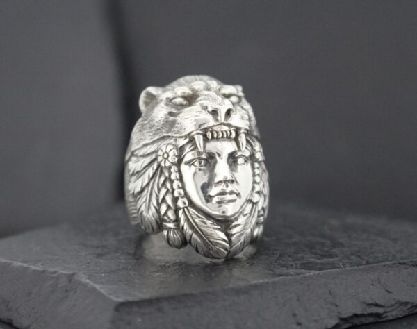 Silver ring featuring a Native American chief wearing a bear headdress.