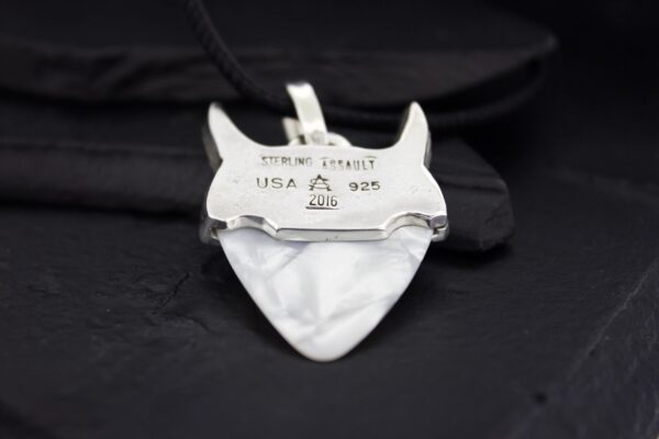 Vintage white porcelain heart-shaped pendant with inscriptions.