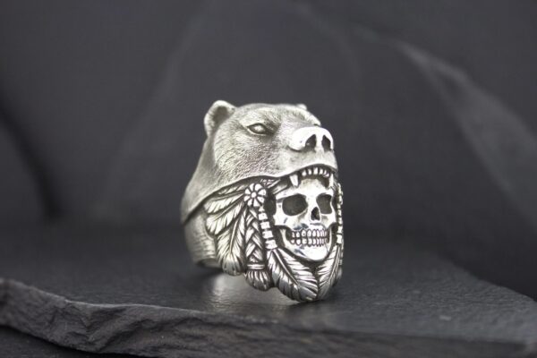 Silver ring featuring a skull with a Native American headdress design.