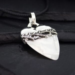 Heart-shaped pendant with a barbed wire design on a black cord.