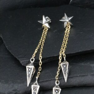 Elegant star and geometric dangle earrings with gold chains.