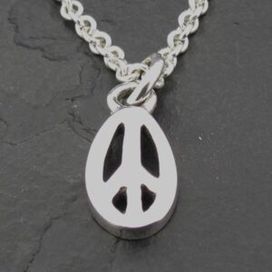 A silver peace symbol pendant on a chain.