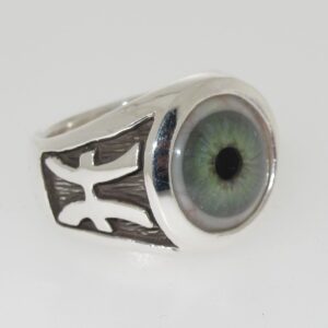 Silver ring with a realistic green eye design and black accents.