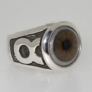 A silver ring with a realistic human eye design.